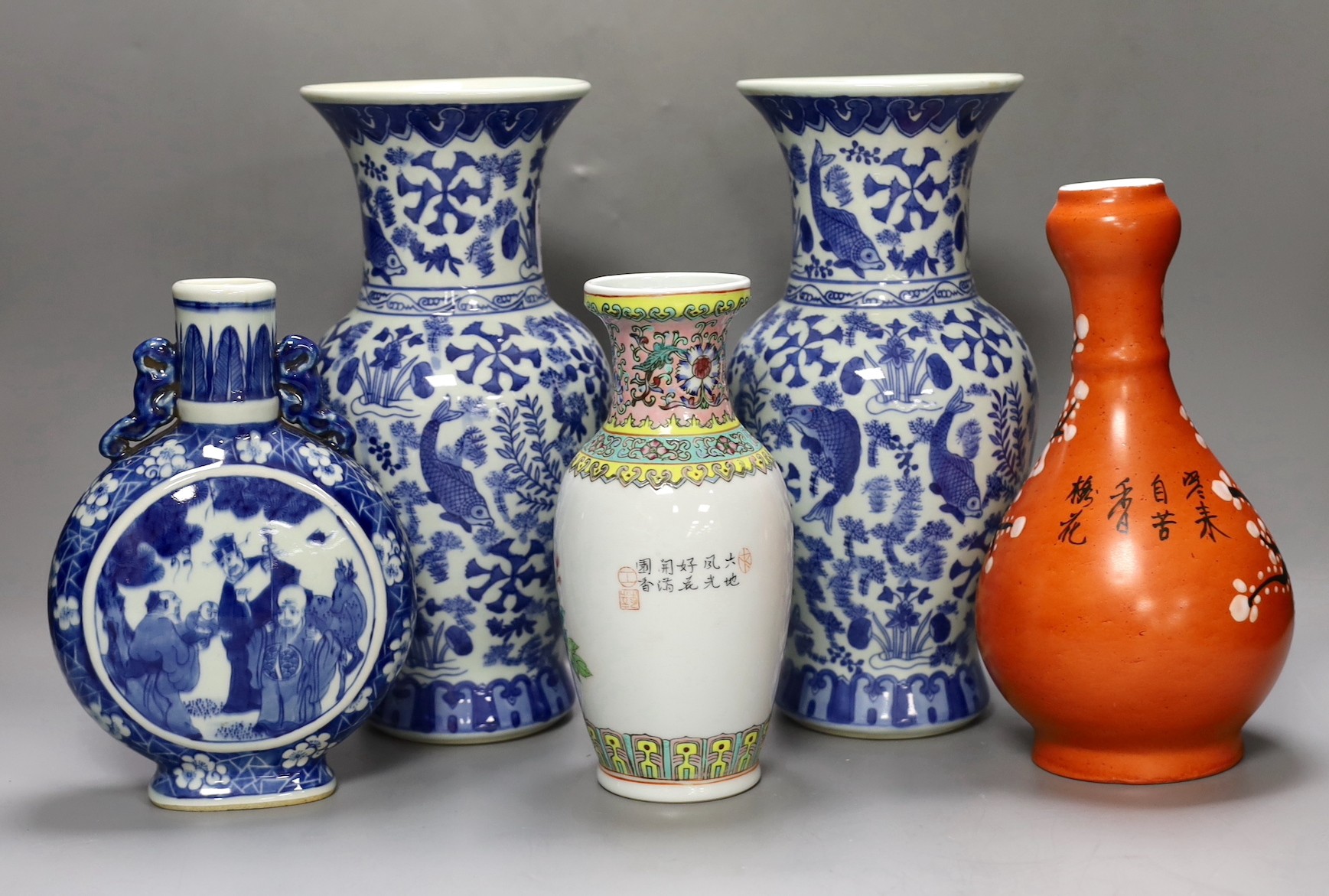 A pair of Chinese blue and white vases, two other vases and a moon flask, tallest 28cm